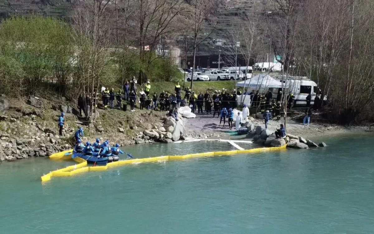 Aerial view of the boom and boat on the river with the exercise area on the bank